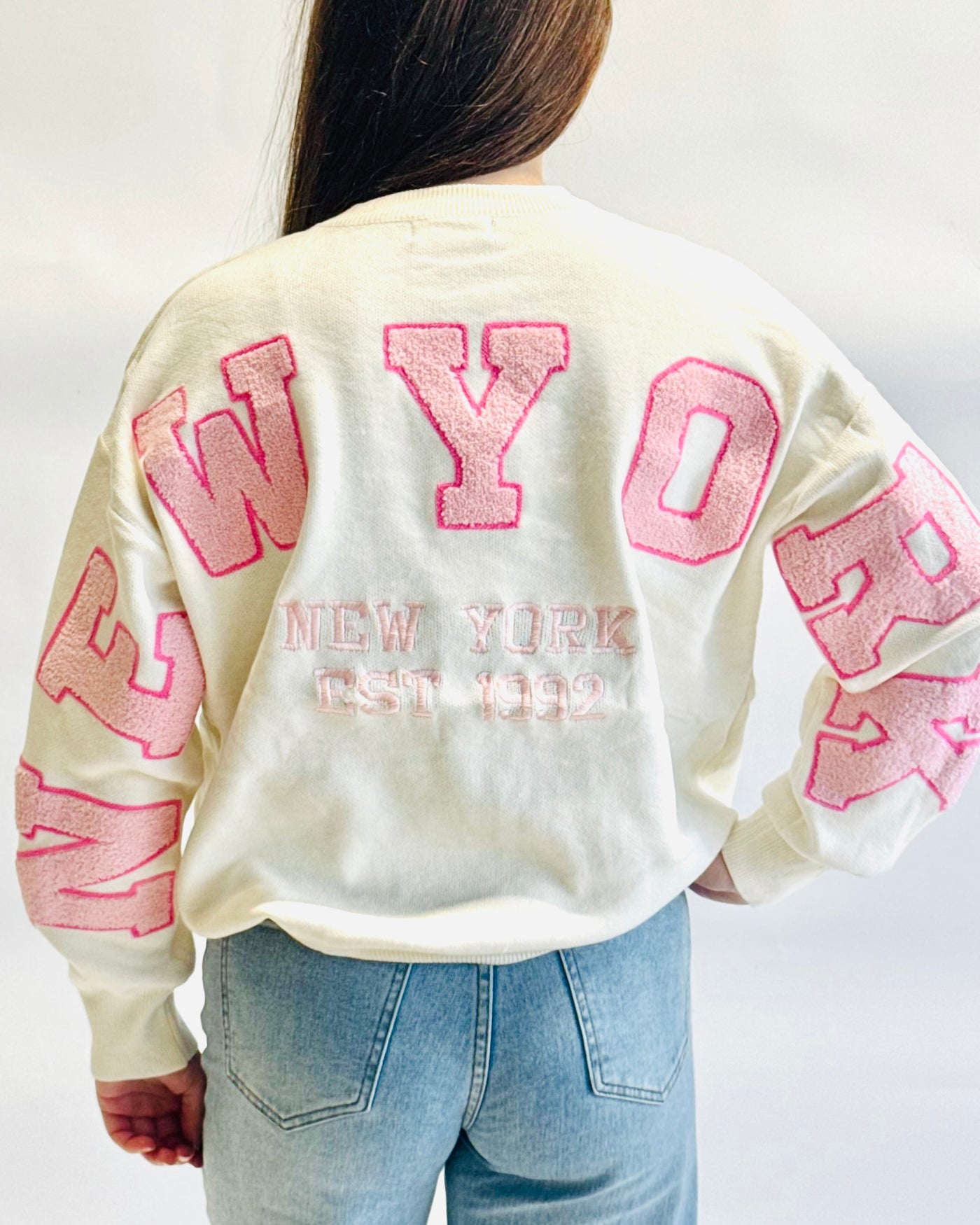 New york trui wit roze